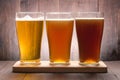 Assortment of beer glasses on a wooden table Royalty Free Stock Photo