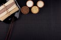 Assortment of bundles raw noodles with ingredient in wooden bowls on black striped mat background with copy space, top view. Royalty Free Stock Photo