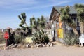 Assortment of cactus in front of vintage building, HackBerry, Arizona
