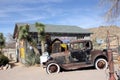 Assortment of cactus in front of vintage building, HackBerry, Arizona