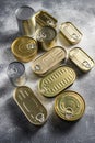 Assortment of cans of canned with different types of shapes top view on grey rustic background side view Royalty Free Stock Photo