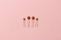 Assortment of ceramic capacitors on pink background