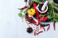 Assortment of chili peppers and herbs Royalty Free Stock Photo