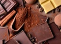 Assortment of chocolate bars, cupcakes, spices and cocoa powder Royalty Free Stock Photo