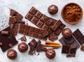 Assortment of chocolate bars, cupcakes, spices and cocoa powder Royalty Free Stock Photo