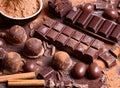 Assortment of chocolate bars, cupcakes, spices and cocoa powder Royalty Free Stock Photo