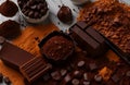 Assortment of chocolate bars, truffles, spices and cocoa powder world chocolate day