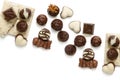 Assortment of chocolate candies from black, milk and white chocolate with nuts and marzipan