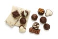 Assortment of chocolate candies from black, milk and white chocolate with nuts and marzipan