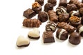 Assortment of chocolate candies from black, milk and white chocolate with nuts and marzipan