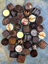 Assortment chocolates on stone background
