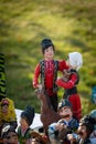 Assortment of clay souvenirs. Souvenir clay figurines of men and women in national Moldovan costumes. Moldavian folk art on Wine