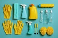 Assortment of cleaning supplies and yellow gloves on a blue background Royalty Free Stock Photo