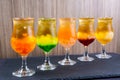 Assortment of Coconut green tea served in glass isolated on background side view of colorful drinks