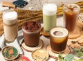 Assortment of coffee drink with American style sparkling drink, matcha milk, Cocoa Latte creamy, served in a glass isolated wooden