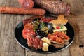 An assortment of cold appetizers served on a black plate Royalty Free Stock Photo