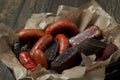 Assortment of cold meats, variety of processed cold meat products in wooden box