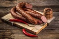 Assortment of cold meats, variety of processed cold meat products. On a wooden background