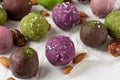 Assortment of colorful bliss balls or energy balls. Vegetarian vegan sugar free sweets on white background