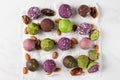 Assortment of colorful bliss balls or energy balls. Vegetarian vegan sugar free sweets on white background. top view