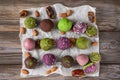 Assortment of colorful bliss balls or energy balls. Vegetarian vegan sugar free sweets on wooden background. top view