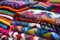 assortment of colorful, hand sewn patchwork quilts