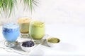 Assortment of colorful Japanese tea latte with milk, green, blue, pink moon milk, golden milk. Fashionable healthy drink has anti-