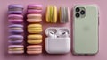 Assortment of colorful macarons arranged in two columns on a pink background Royalty Free Stock Photo