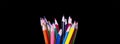 Assortment of coloured pencils on black background Royalty Free Stock Photo