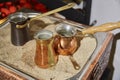 Assortment of copper cezve for making Turkish coffee Royalty Free Stock Photo