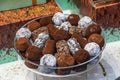 Assortment of dark, white and milk chocolate stack, chips. Chocolate and coffee beans on rustic wooden sacking