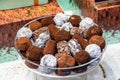 Assortment of dark, white and milk chocolate stack, chips. Chocolate and coffee beans on rustic wooden sacking