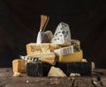 Assortment of different cheese types on wooden background. Cheese background Royalty Free Stock Photo