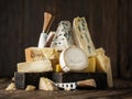Assortment of different cheese types on wooden background. Cheese background Royalty Free Stock Photo