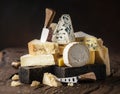 Assortment of different cheese types on wooden background. Cheese background Royalty Free Stock Photo