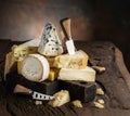 Assortment of different cheese types on wooden background. Cheese background