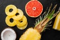 Assortment of different fruits, on black dark stone table background, top view flat lay Royalty Free Stock Photo