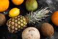 Assortment of different fruits, on black dark stone table background, top view flat lay Royalty Free Stock Photo
