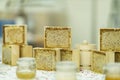 Jars of honey, Honey in honeycombs, production of honey. Gastronomic farm market counter, real scene Royalty Free Stock Photo