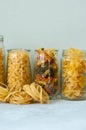 Assortment of different shapes whole grain raw Italian pasta in Royalty Free Stock Photo