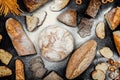 Assortment of different types of bread on a black background. Top view Royalty Free Stock Photo
