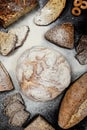 Assortment of different types of bread on a black background. Top view Royalty Free Stock Photo