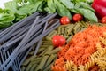 Assortment of different types of gluten-free penne pasta from chickpeas, red lentils, peas