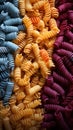assortment of different types of pasta in different colors.