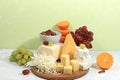 Assortment of different varieties of cheeses, grapes and nuts, fruits, the basis of the French diet, healthy and natural food Royalty Free Stock Photo