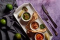 Assortment of dips with pita on a plate. Hummus , guacamole and a spicy dip in small bowls