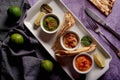 Assortment of dips with pita on a plate. Hummus , guacamole and a spicy dip in small bowls
