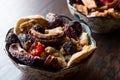 Assortment dried fruits; Apple apricot mulberry cranberry date raspberry red raisin and fig in bowl. Royalty Free Stock Photo