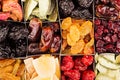 Assortment of dried fruits closeup background in square cells. Royalty Free Stock Photo