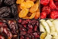 Assortment of dried fruits closeup background in square cells. Royalty Free Stock Photo